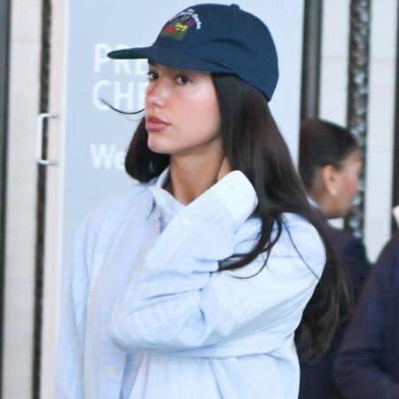 Dua Lipa styled her airport. outfit with summer 2026's straight-leg denim trend 