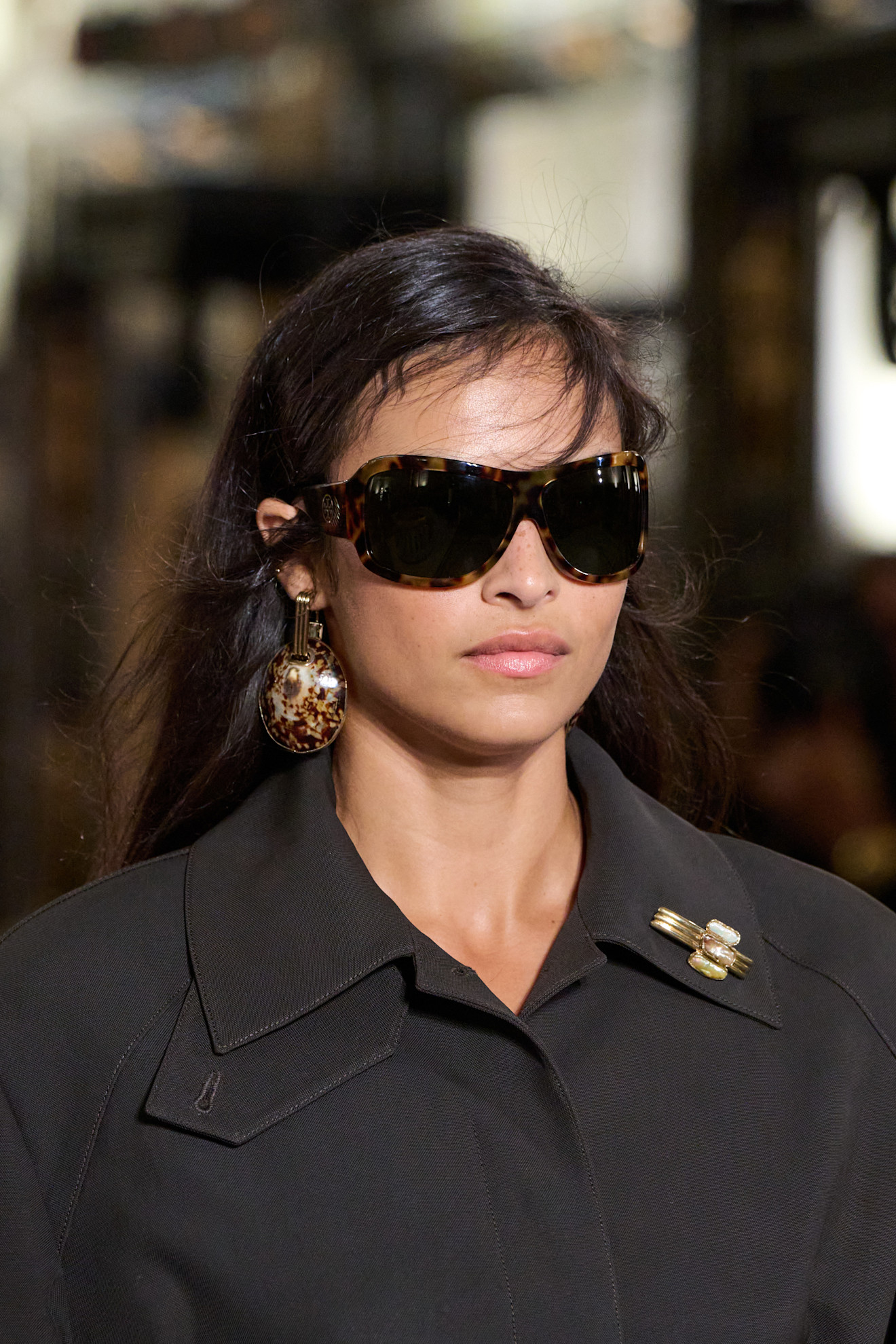 Photos of runway models wearing bug-eye sunglasses during the Spring Summer 2026 season.