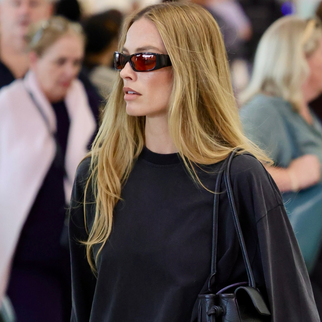 Margot Robbie at the Australia airport in a Fall 2026 elongated Bermuda shorts trend