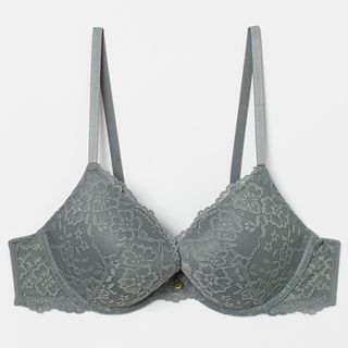 model wearing a sage green bra with lace from H&M