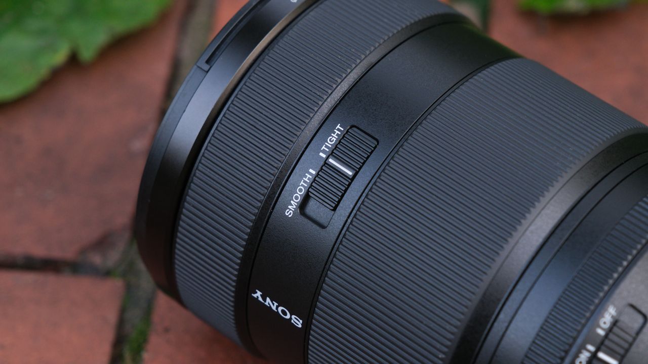 Close-up of the smooth tight switch on a Sony FE 28-70mm f/2 GM lens