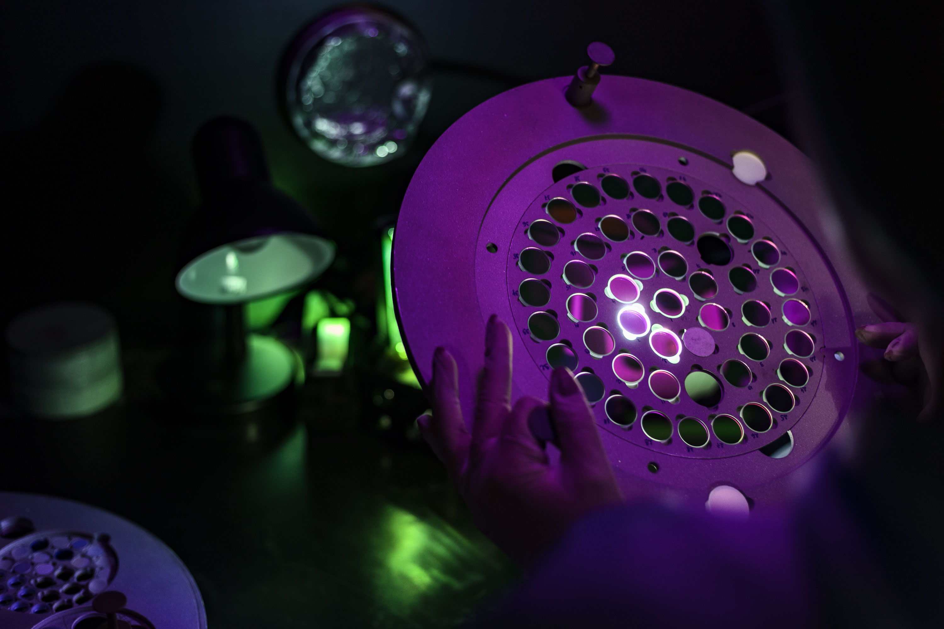 A purple device with lots of circles on it that are arranged in patterns of concentric circles.