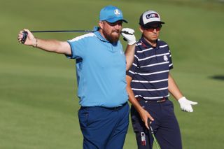 Shane Lowry of Team Europe and Rickie Fowler of Team United States on the ninth hole during the Friday morning foursomes matches of the 2023 Ryder Cup