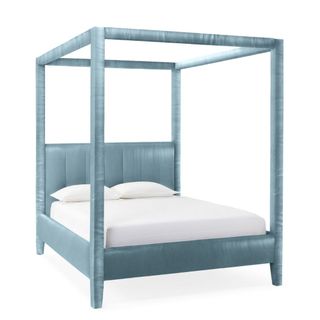 A blue four poster bed