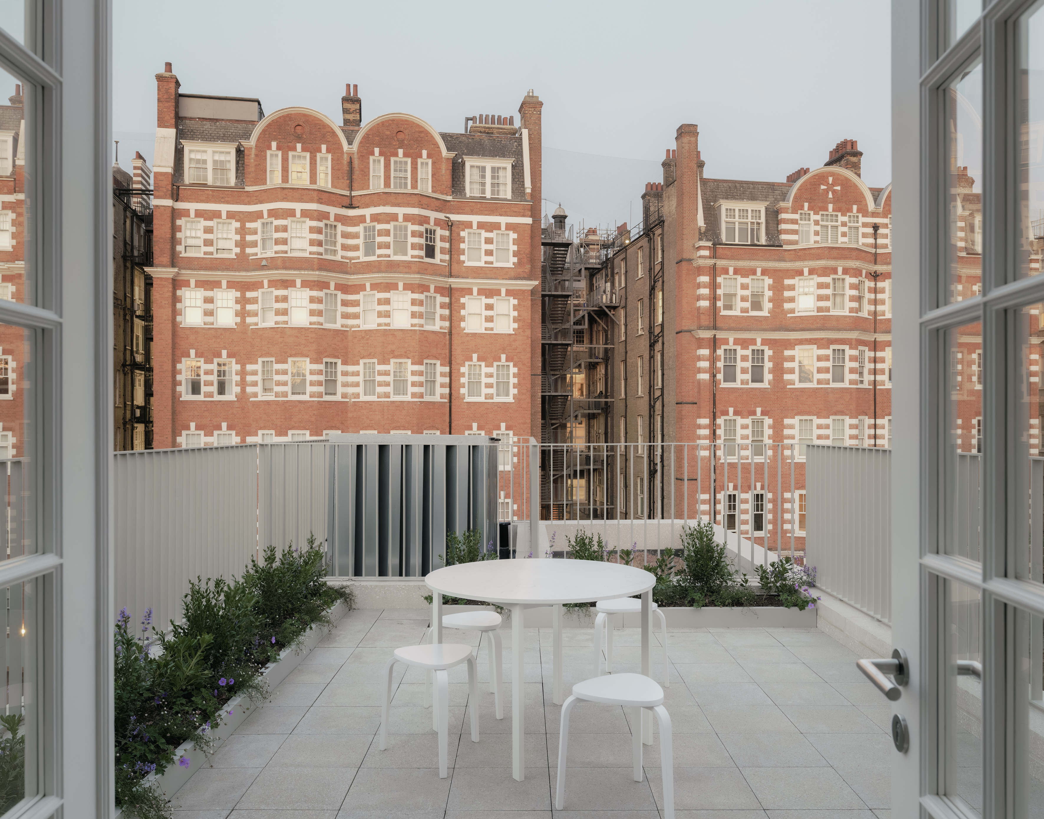20 Newcourt Street, by Wendover, a london development of old and new with round columns and brick frontage