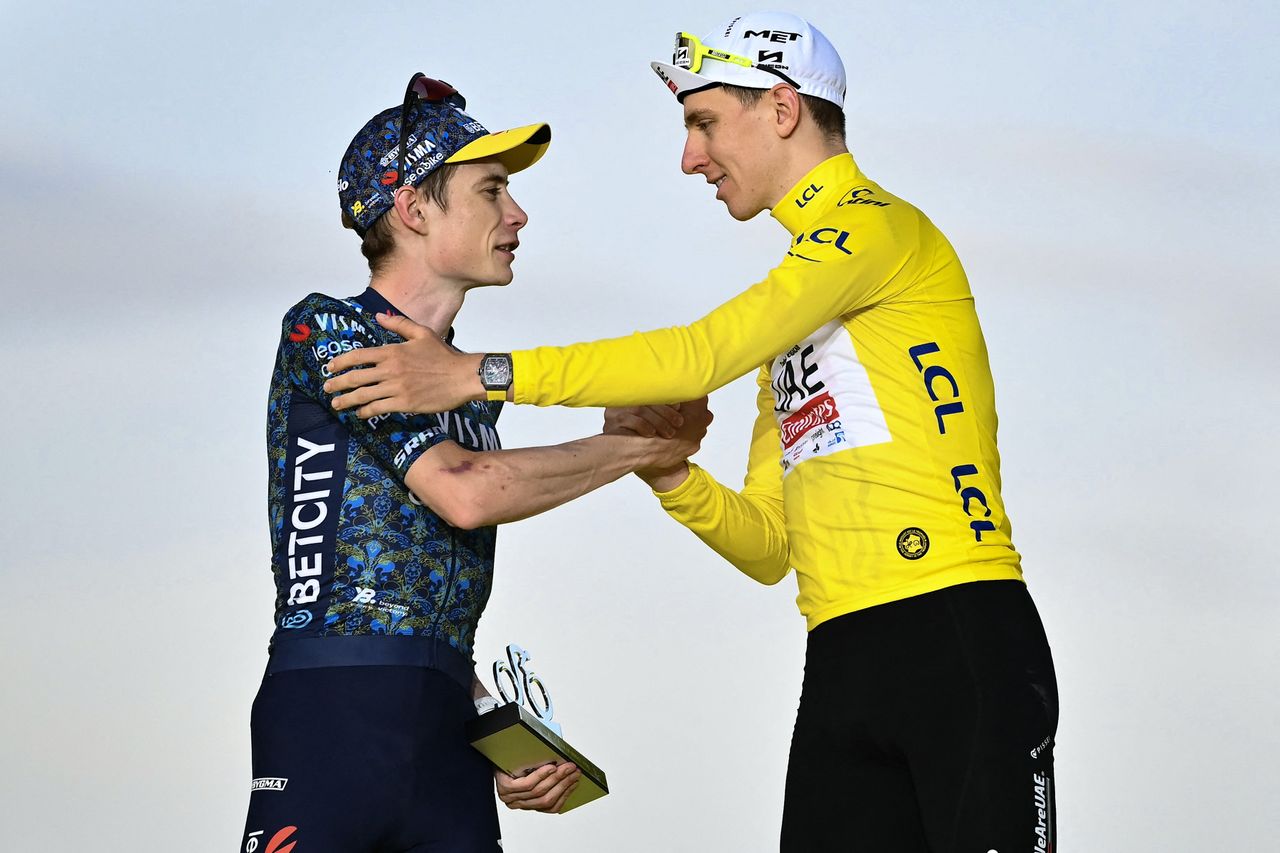 Jonas Vingegaard shakes hands with Tadej Pogačar on the podium of the 2024 Tour de France