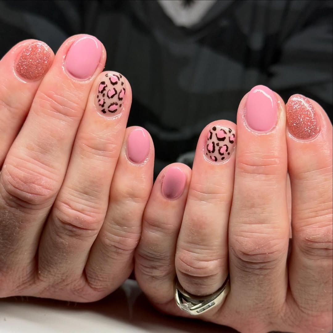 leopard nails with light pink and sparkle accent nails