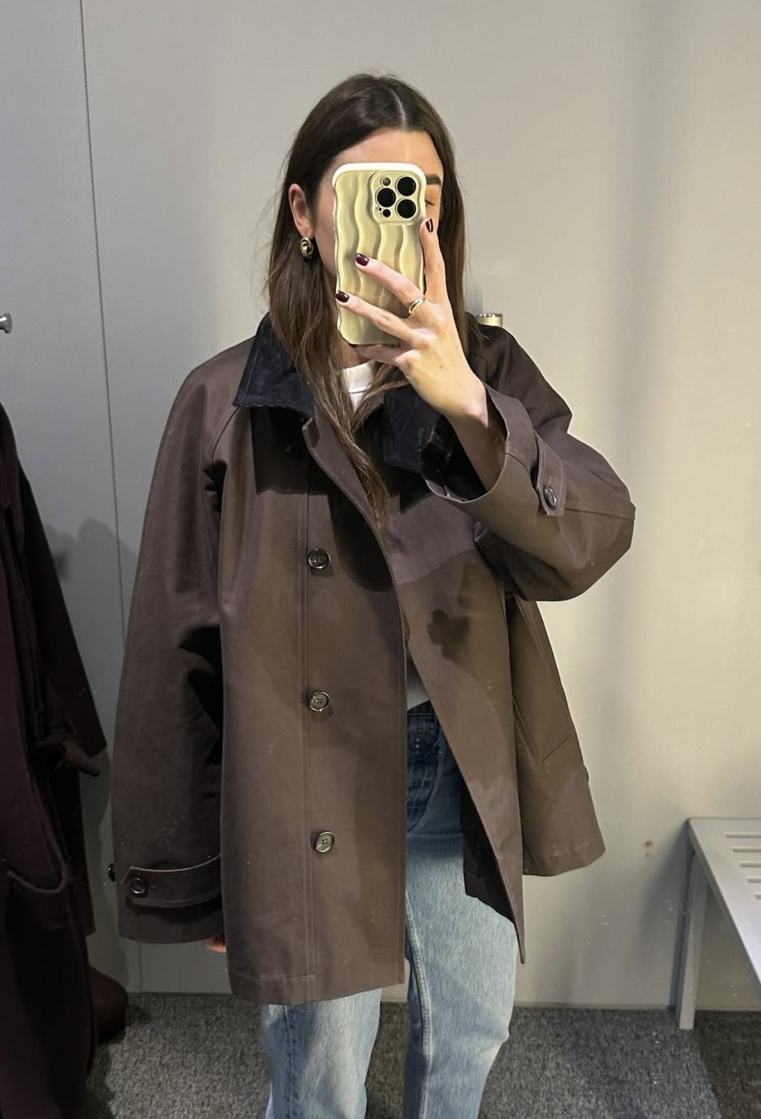 Anna Newton wearing a chocolate brown barn jacket from Arket.