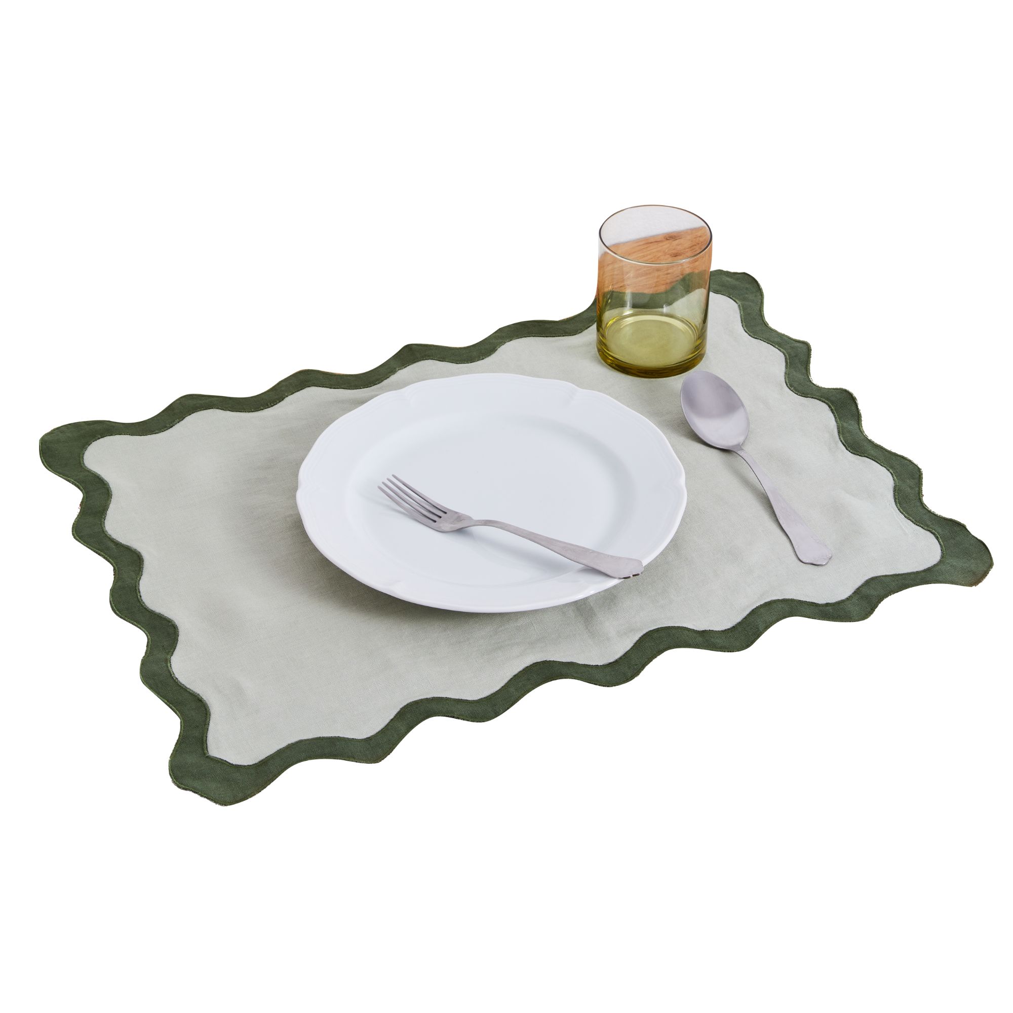 Pale green scalloped placemat with dark green trim