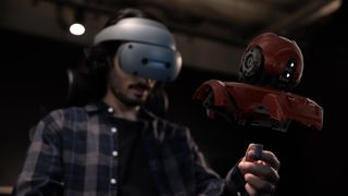 A man uses the unnamed Sony XR headset to create a 3D virtual object using the smart ring controller.