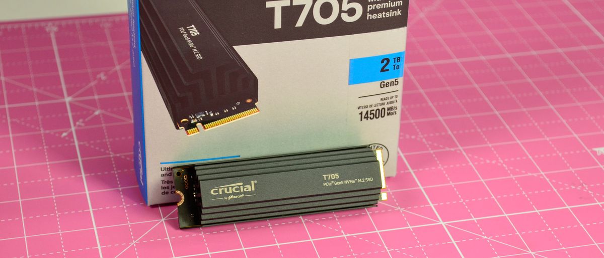 A Crucial T705 SSD on a pink desk mat