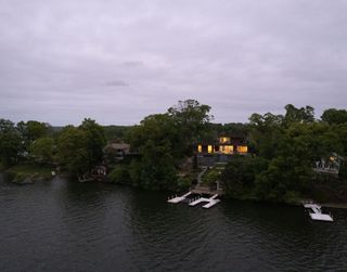 Aerial view from the water of Lake House by Worrell Yeung