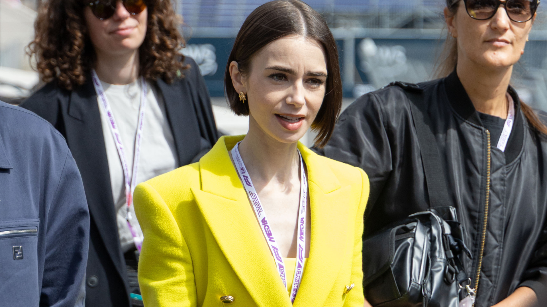 Lily Collins pulled off a neon green and purple color combination at the Formula 1 Monaco Grand Prix
