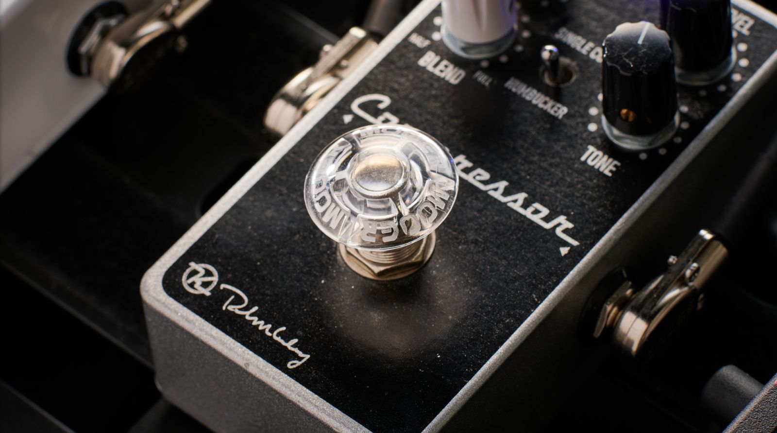 A Mooer footswitch topper on a Keeley Compressor pedal