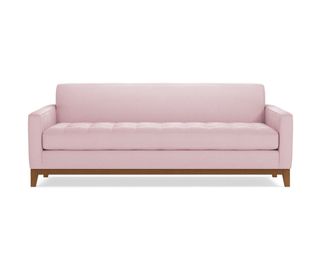 A pink queen sleeper sofa bed