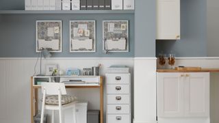 blue and white kitchen and home office multifunctional space showing interior design trends 2022