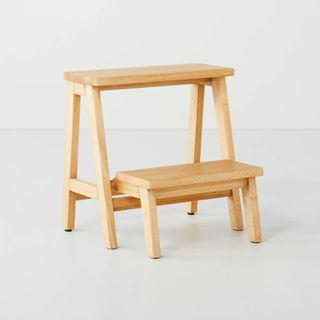 A two-tiered wooden stool