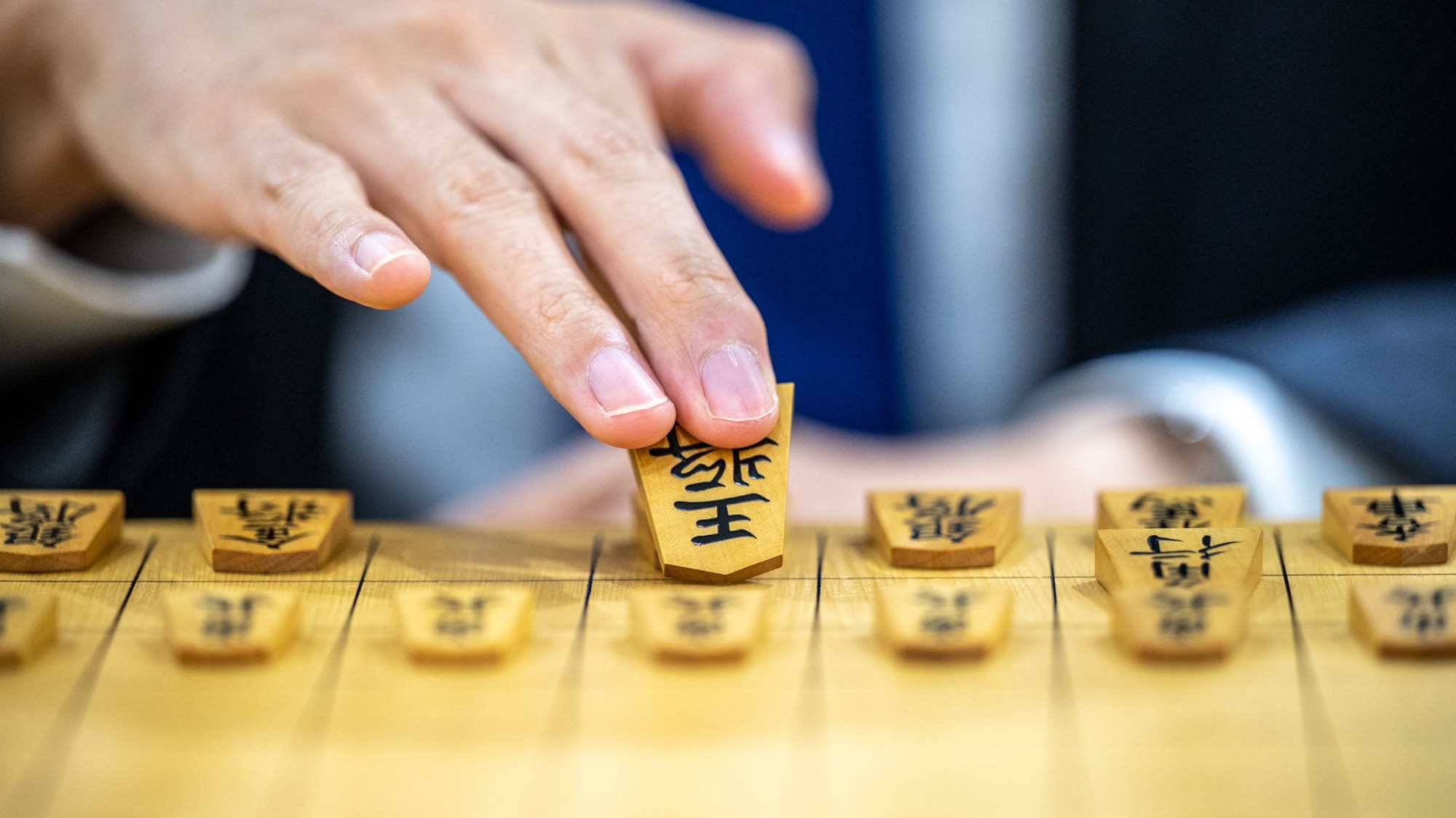 A player playing Shogi, a Japanese game similar to chess