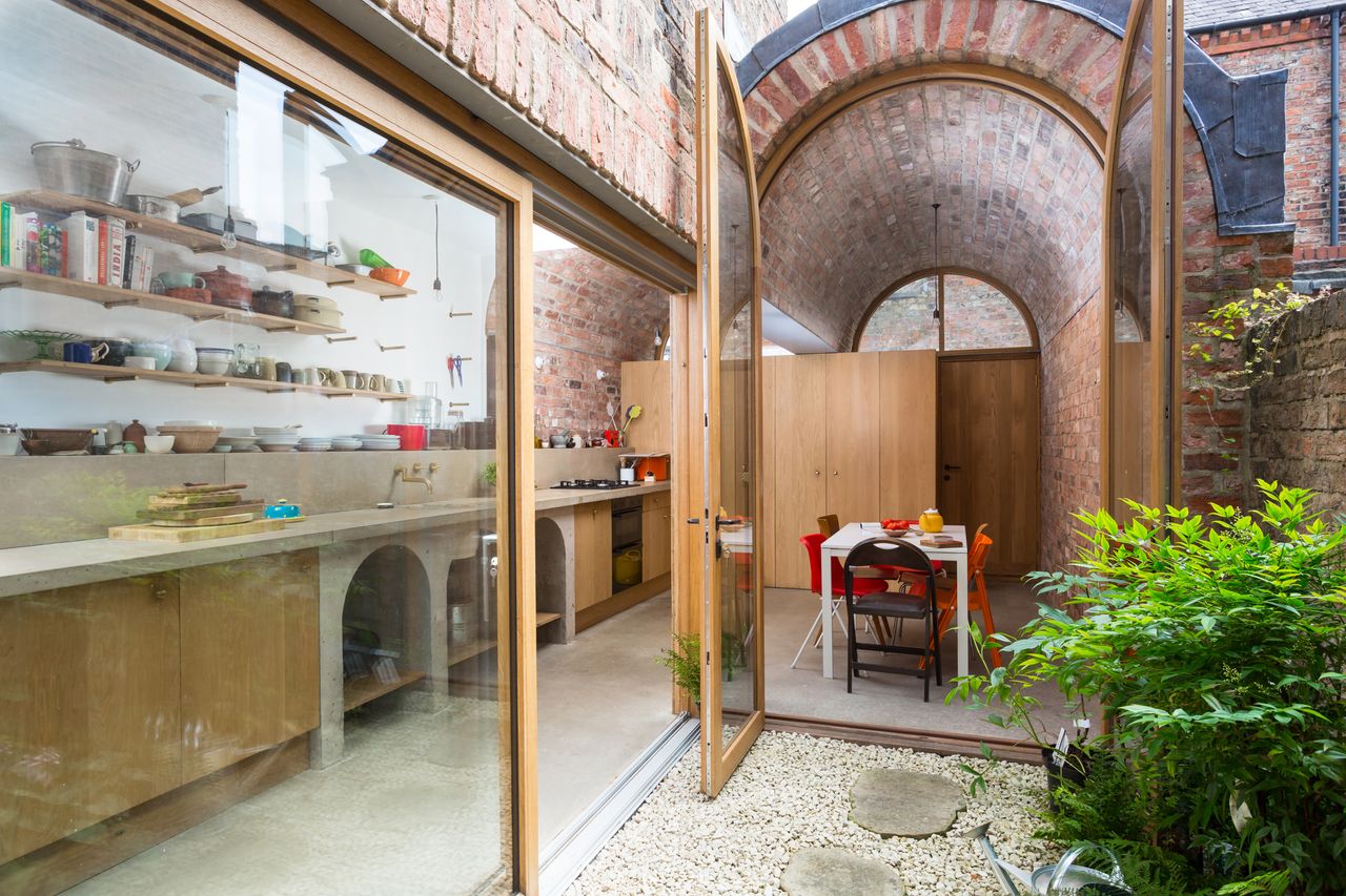 courtyard garden with view to kitchen diner through patio doors