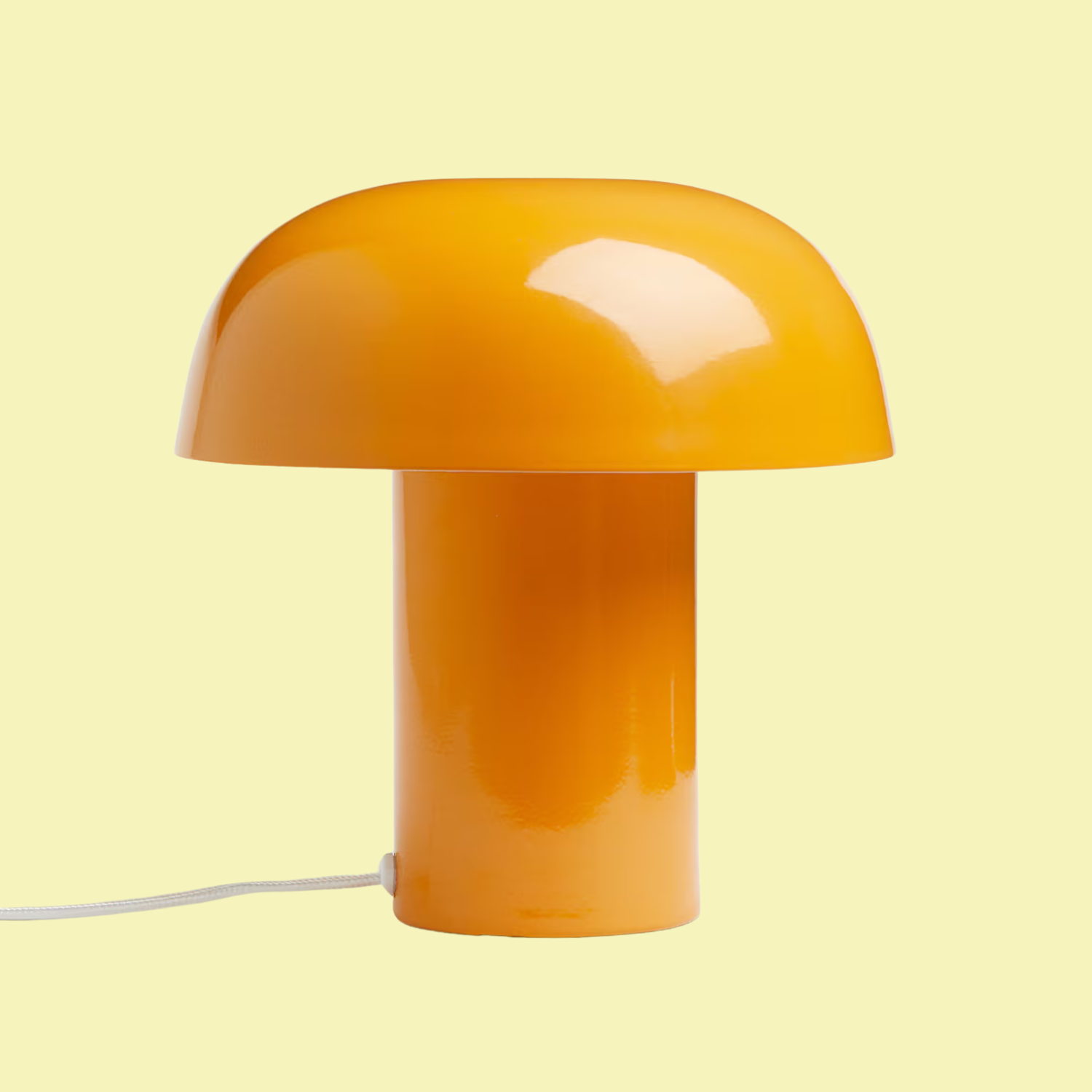 An orange metal table lamp