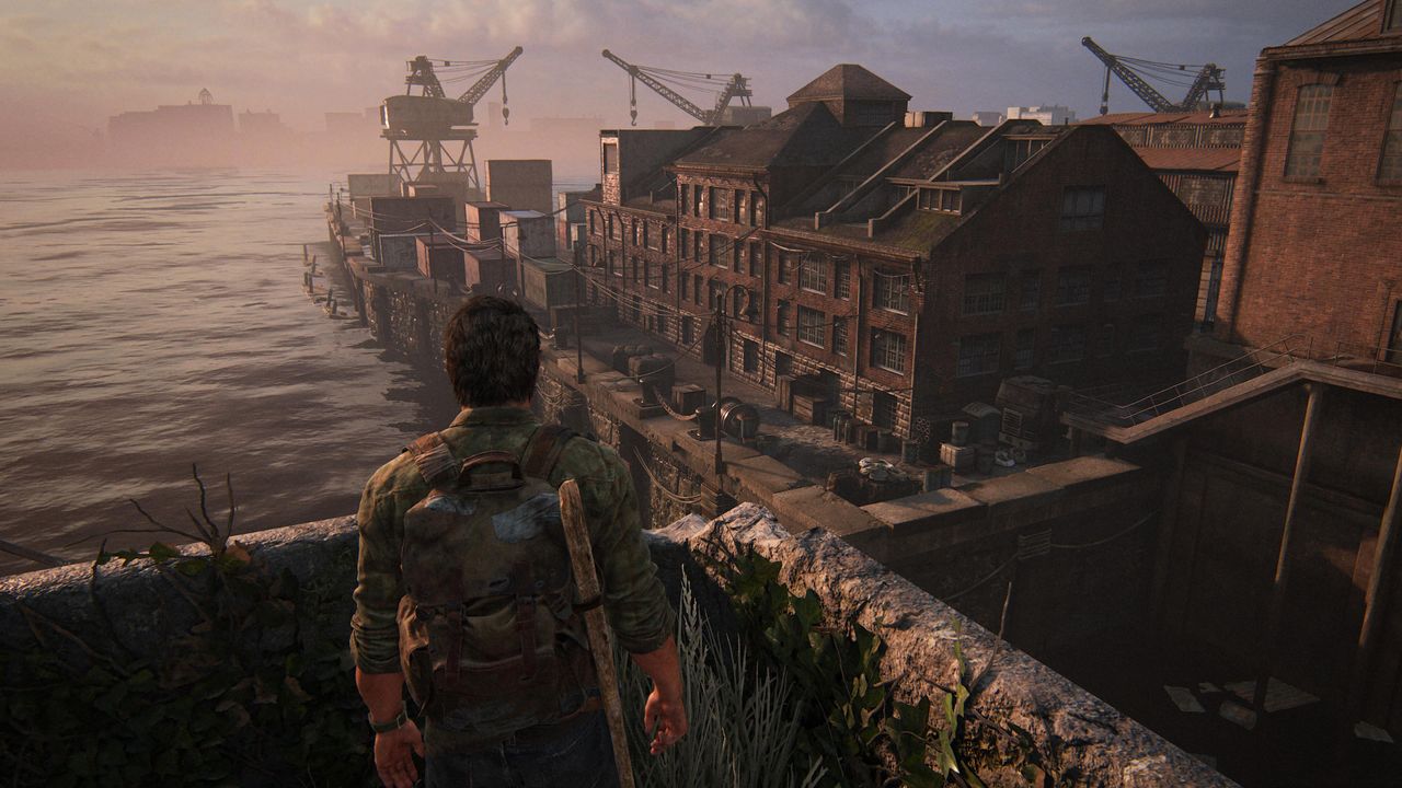 Joel stares across harbour in The Last of Us Part I