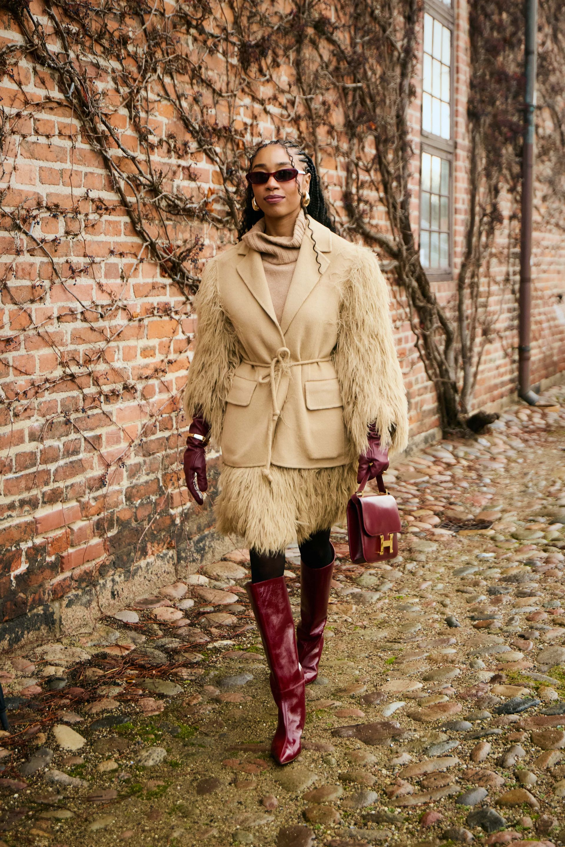 Show goer wears the butter and burgundy colour combination during Fashion Week