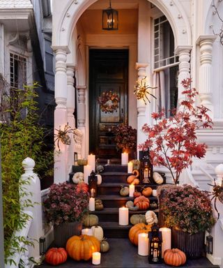 halloween porch steps with pumpkins and large light up spiders