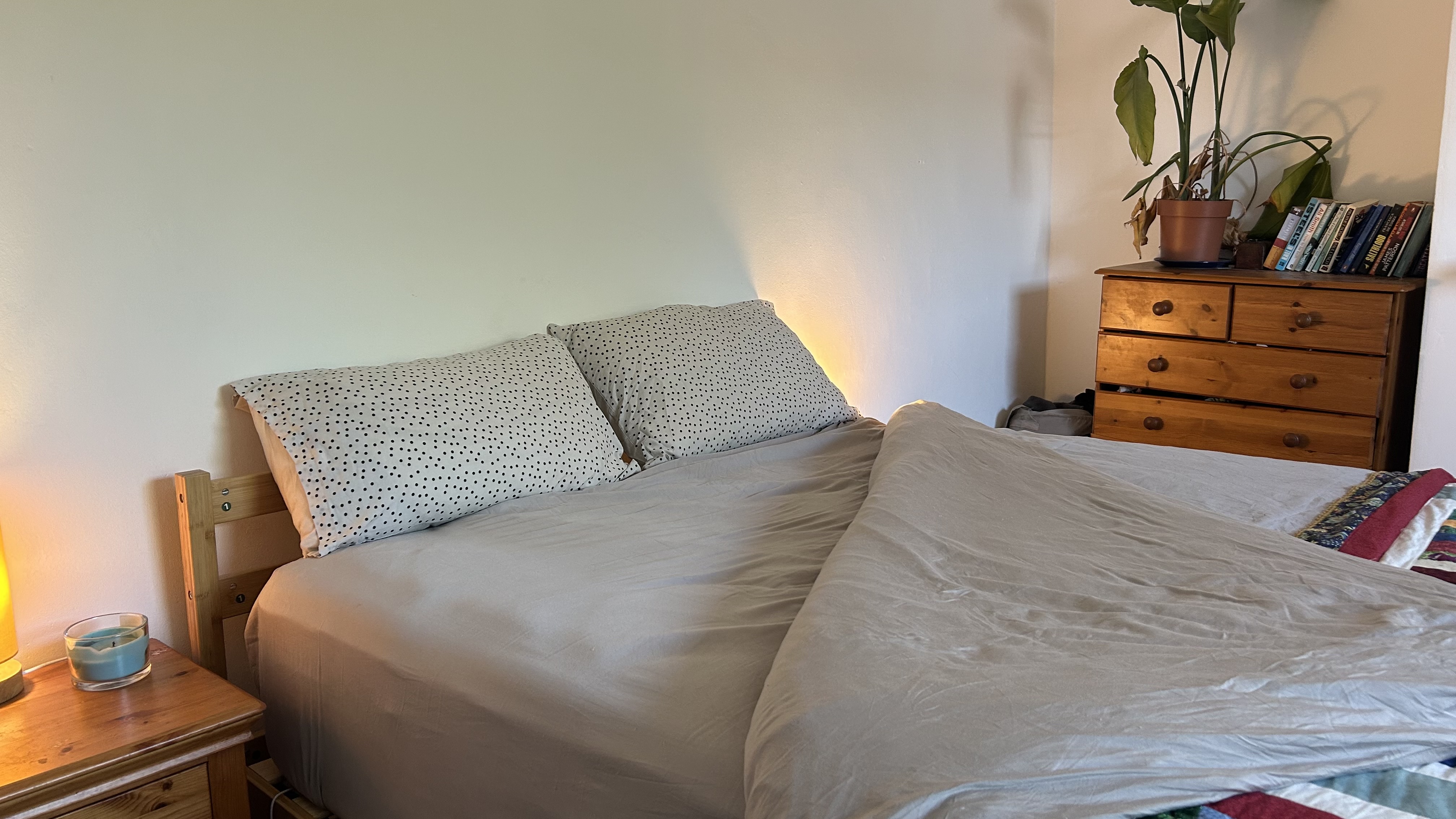 The DreamCloud Luxe Memory Foam mattress dressed in grey bedding