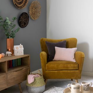 grey living room with comfy seating and accent colour