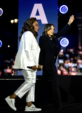 Democratic presidential nominee, U.S. Vice President Kamala Harris (R) speaks alongside Oprah Winfrey during the closing rally of her campaign at the base of the iconic "Rocky Steps" at the Philadelphia Museum of Art on November 05, 2024 in Philadelphia, Pennsylvania. With one day to go until election day, Vice President Kamala Harris is campaigning across Pennsylvania.