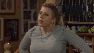 Stephanie standing with hands on her hips inside Tanner kitchen in Fuller House