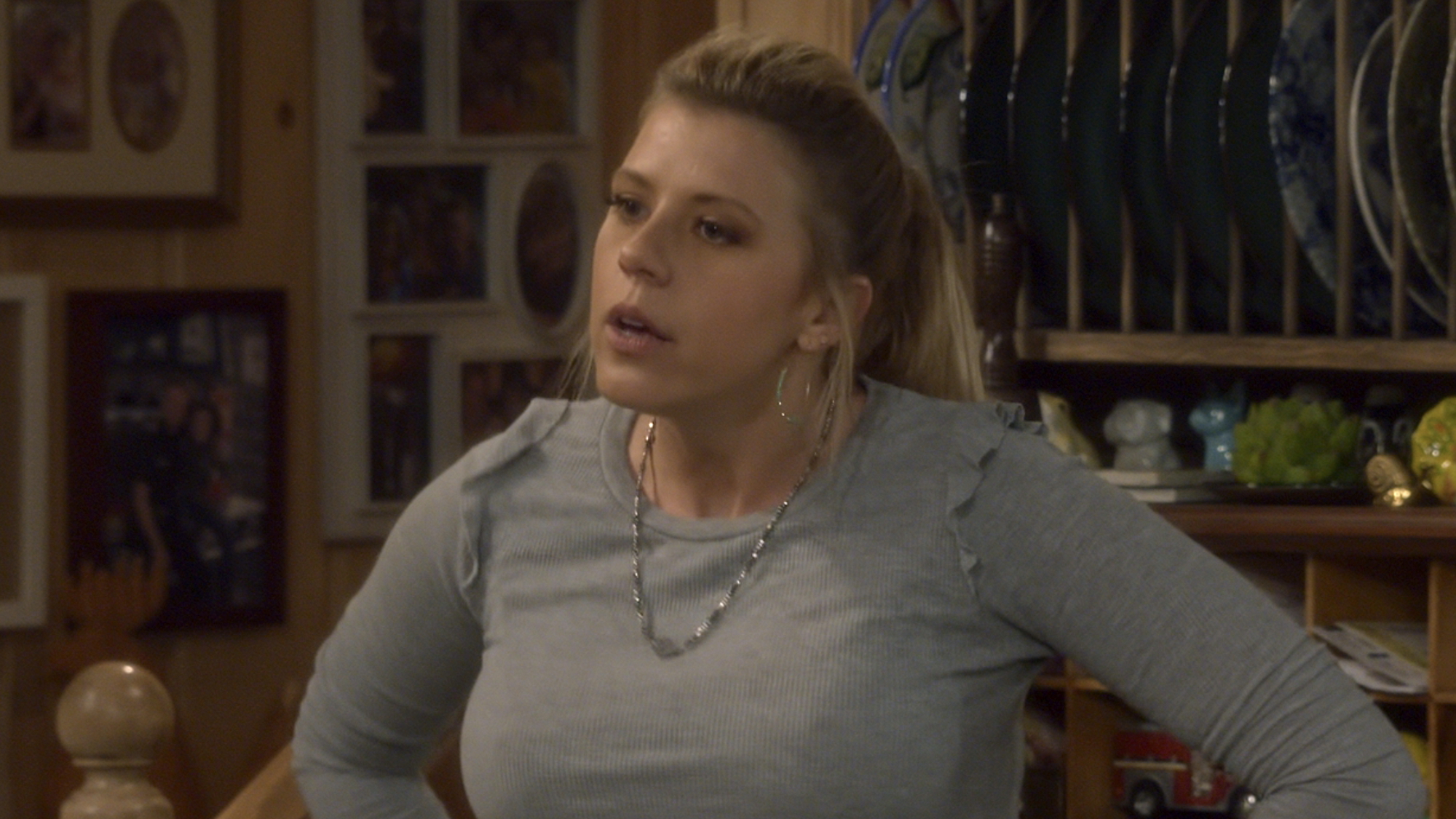 Stephanie standing with hands on her hips inside Tanner kitchen in Fuller House