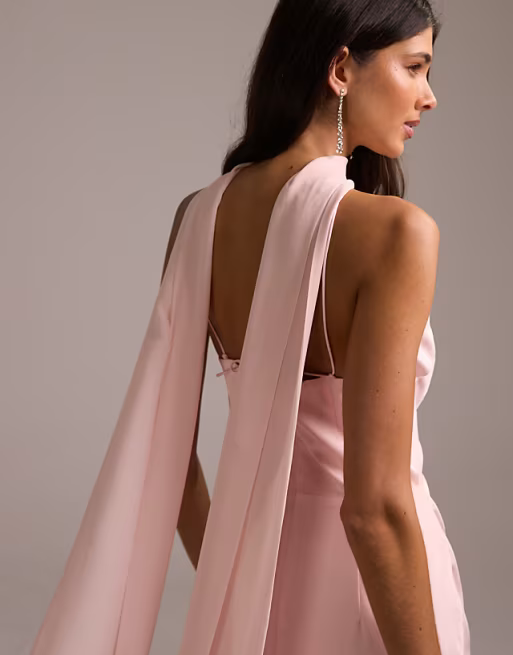A model wearing a pink Asos bridesmaid dress.