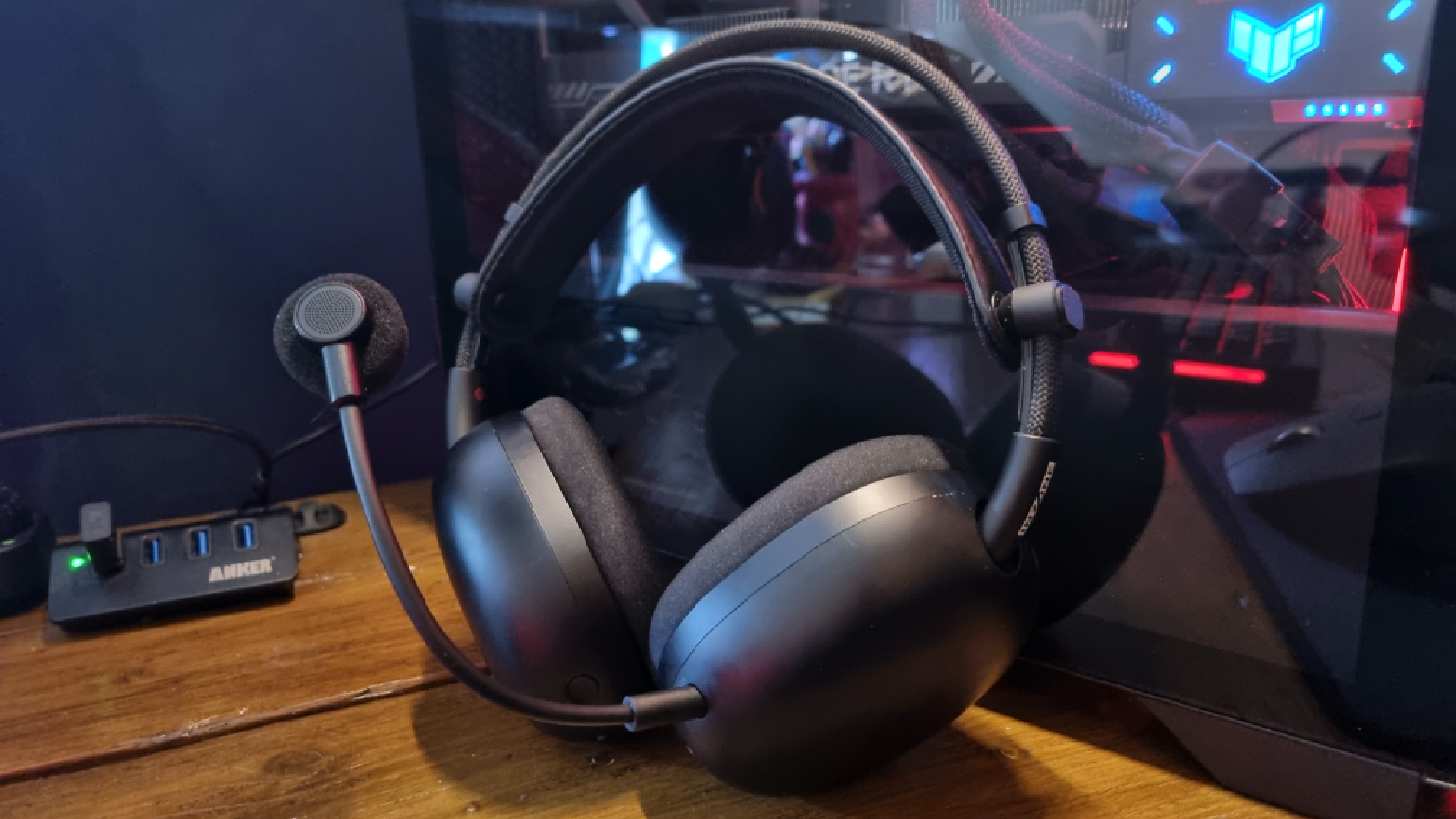 The Sony Inzone H9 II gaming headset resting up against a gaming PC