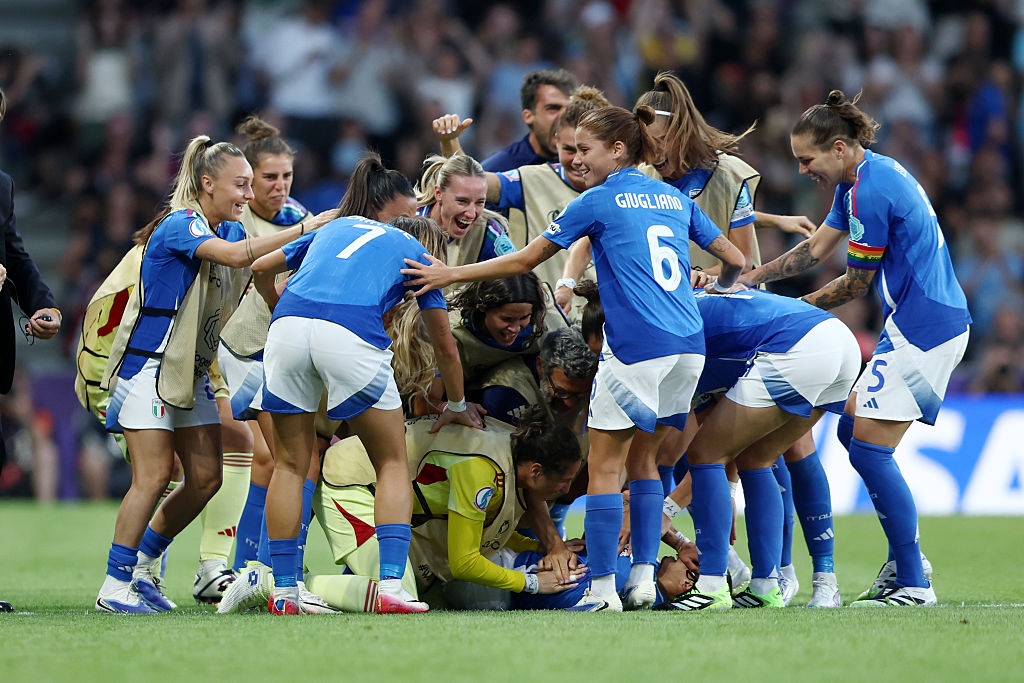 Italy celebrate a goal against Spain