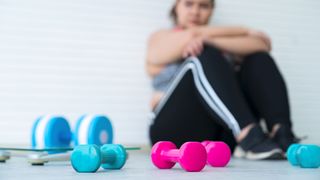 Does exercise help anxiety? image shows woman with fitness weights