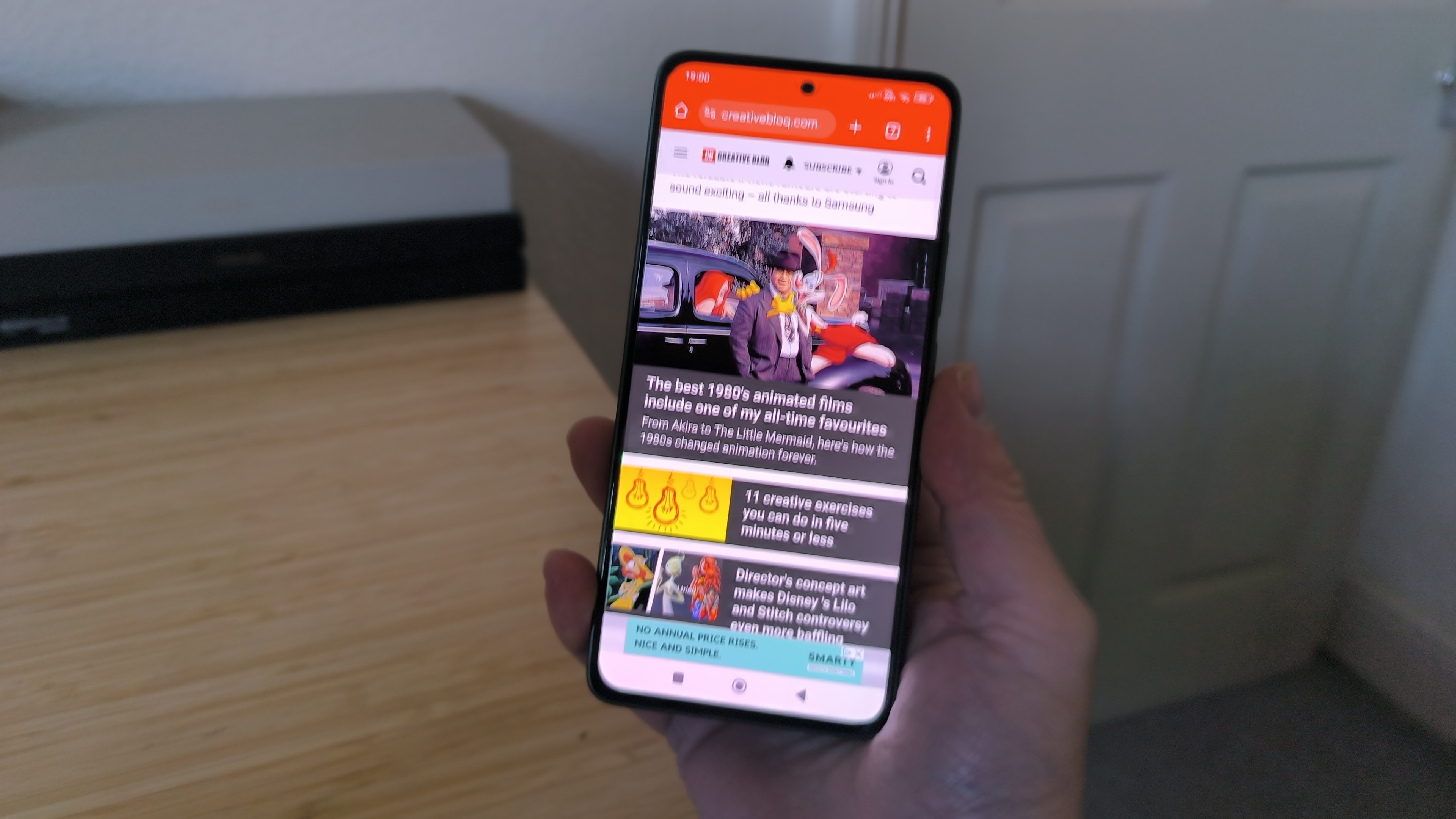 Hand holding up Poco M7 Pro