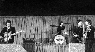 The Beatles perform at Dodger Stadium on August 28, 1966 in Los Angeles, California
