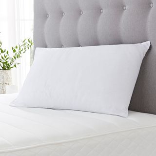 mattresses with grey headboard and pillow