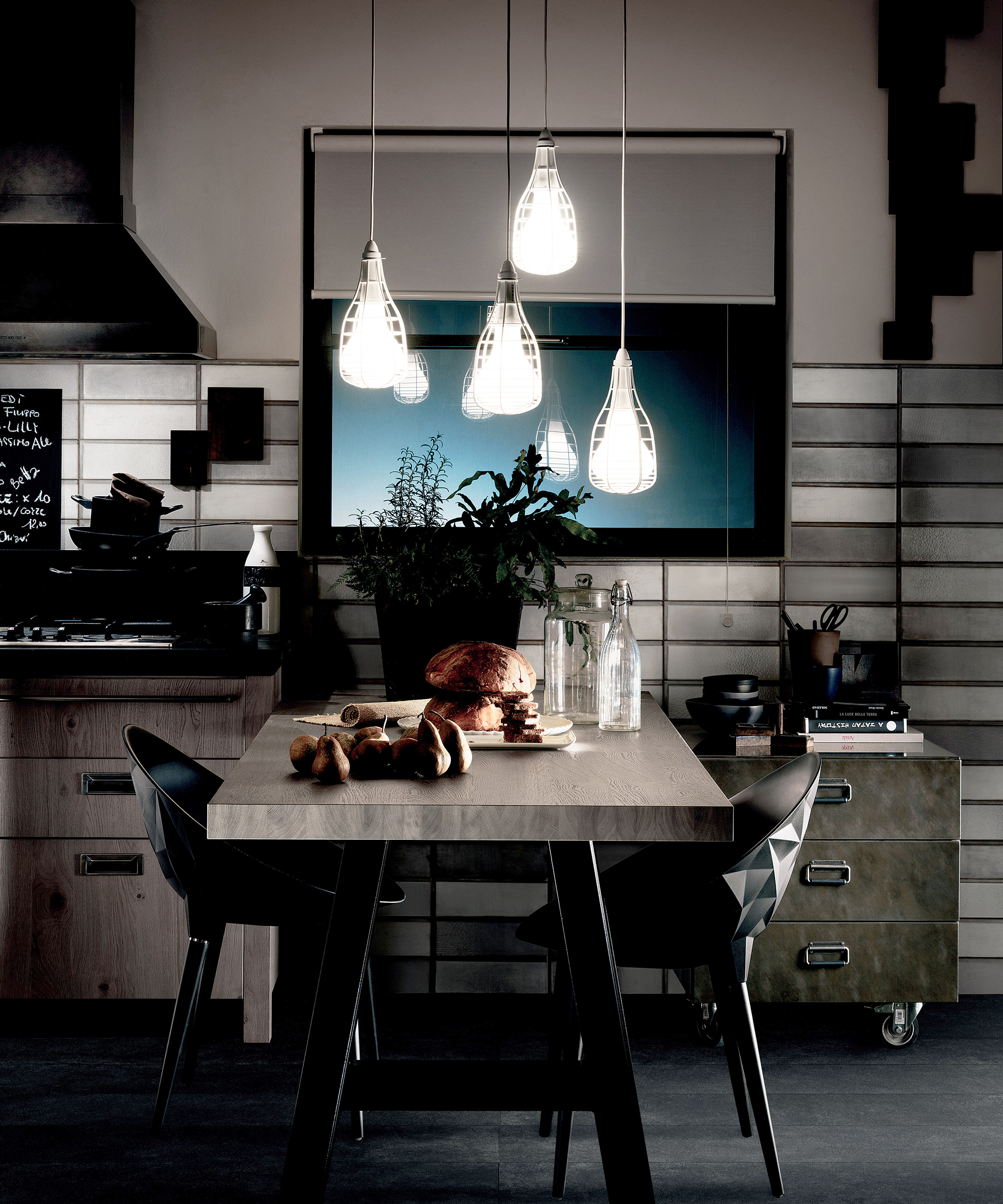 A dark small dining area in a kitchen with low-level lighting