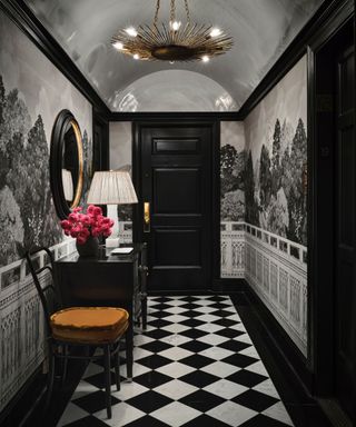 Black and white tiled floor, black doors and mirror, black and white wallpaper