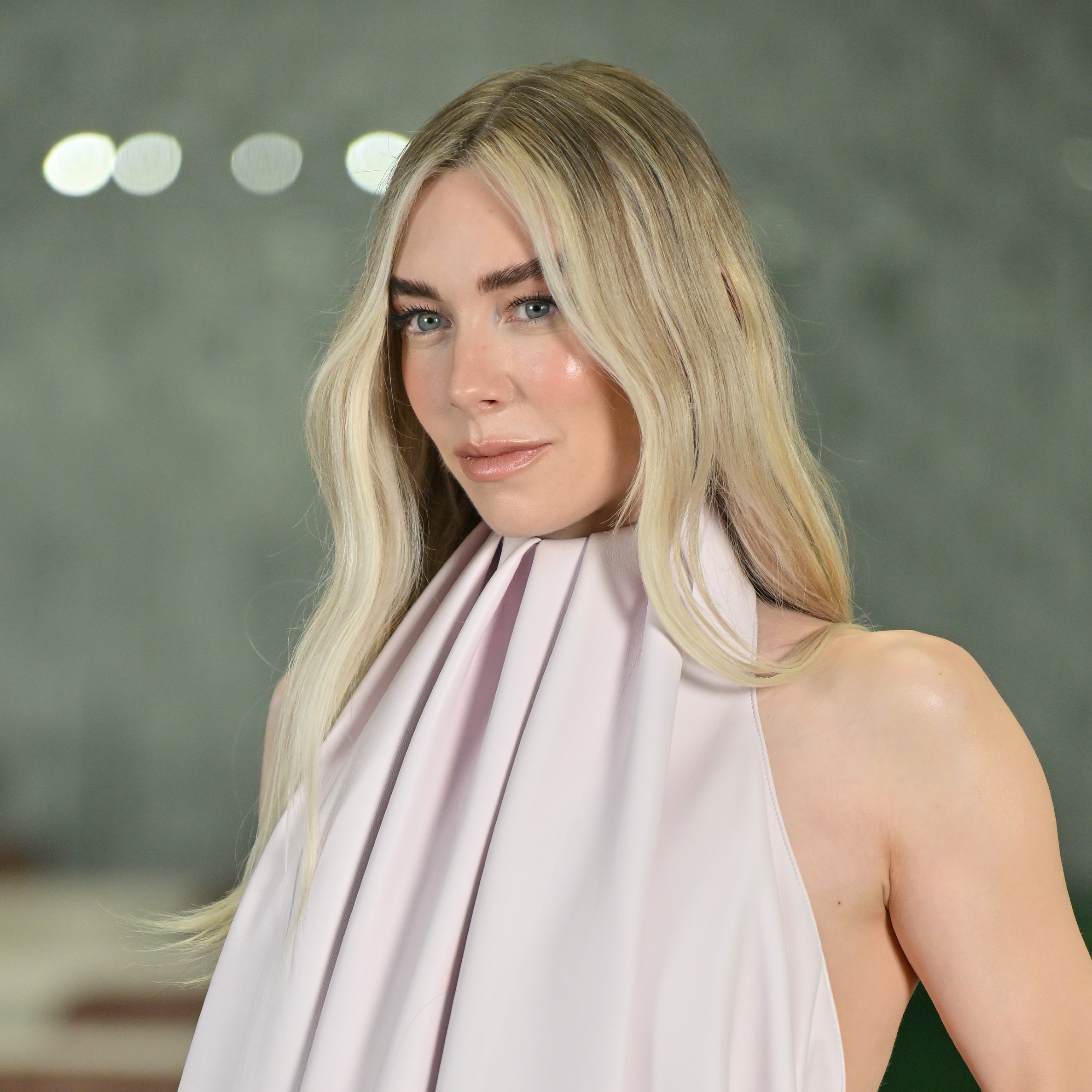 Vanessa Kirby posing with her hair highlighted.