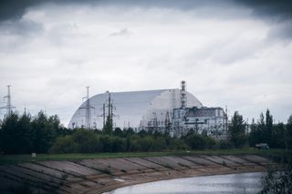 The New Safe Confinement shelter over the remains of reactor 4 and the old sarcophagus at Chernobyl nuclear power plant.