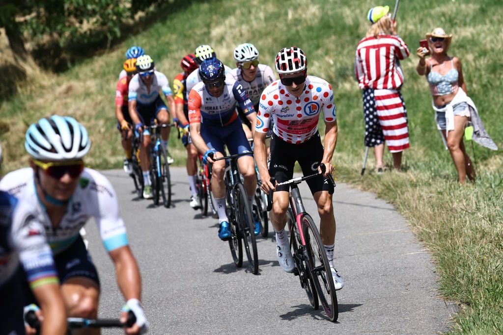 EF Education - Easypost's US rider Neilson Powless wearing the best climber's polka dot (dotted) jersey cycles in a breakaway during the 14th stage of the 110th edition of the Tour de France cycling race, 152 km between Annemasse and Morzine Les Portes du Soleil, in the French Alps, on July 15, 2023. (Photo by Anne-Christine POUJOULAT / AFP)
