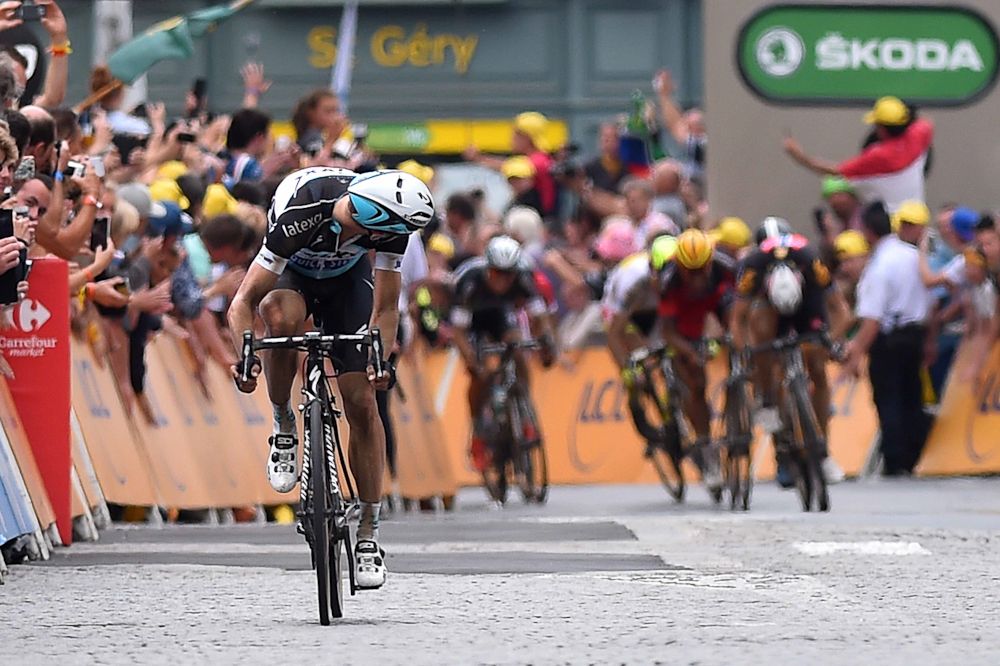 Tony Martin checks back as he solos to the line to win stage 4 of the 2015 Tour de France.