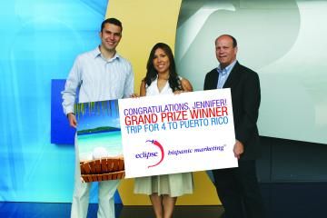 158356-NBC_Universal_marketing_manager_TV_networks_distribution_Jennifer_Sanchez_c_accepts_the_trip_to_Puerto_Rico_she_won_in_the_0.jpg