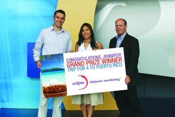 158356-NBC_Universal_marketing_manager_TV_networks_distribution_Jennifer_Sanchez_c_accepts_the_trip_to_Puerto_Rico_she_won_in_the_0.jpg