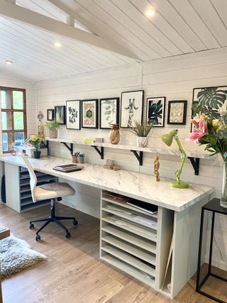 diy desk with a marble effect worktop and bespoke storage for an artists studio