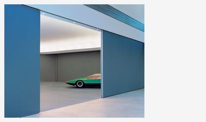 Green car in parking garage