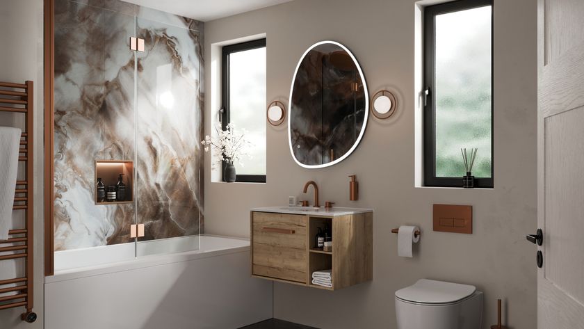bathroom with two windows, shower over bath, wall mounted vanity, back to wall toilet and copper colour towel radiator and brassware